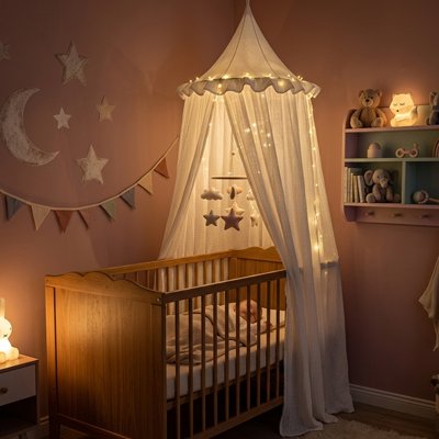 Ciel de lit blanc illuminé berceau